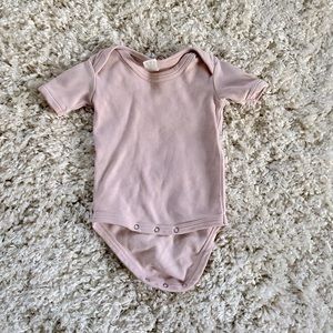 Kate Quinn dusty pink onesie